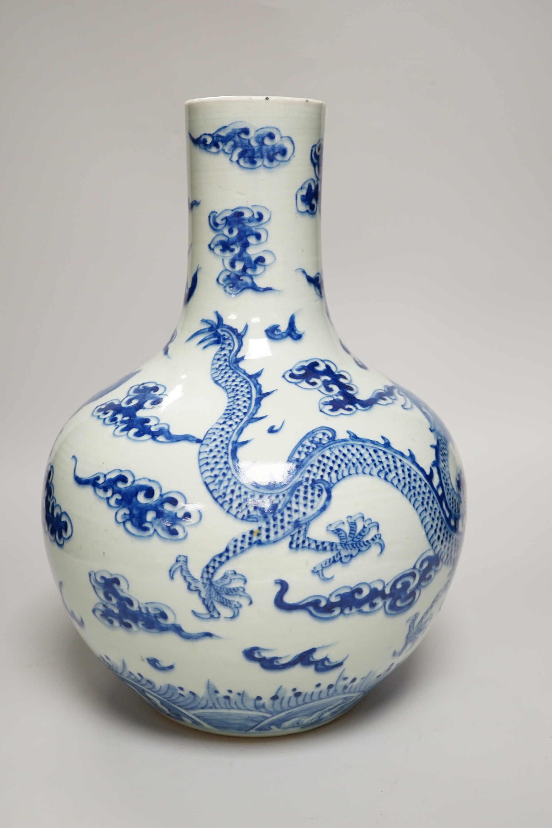 A Chinese blue and white ‘Dragon’ vase, tianqiuping, Qianlong mark but 19th century, 34cm